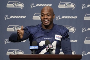 Activa Seattle al corredor Adrian Peterson